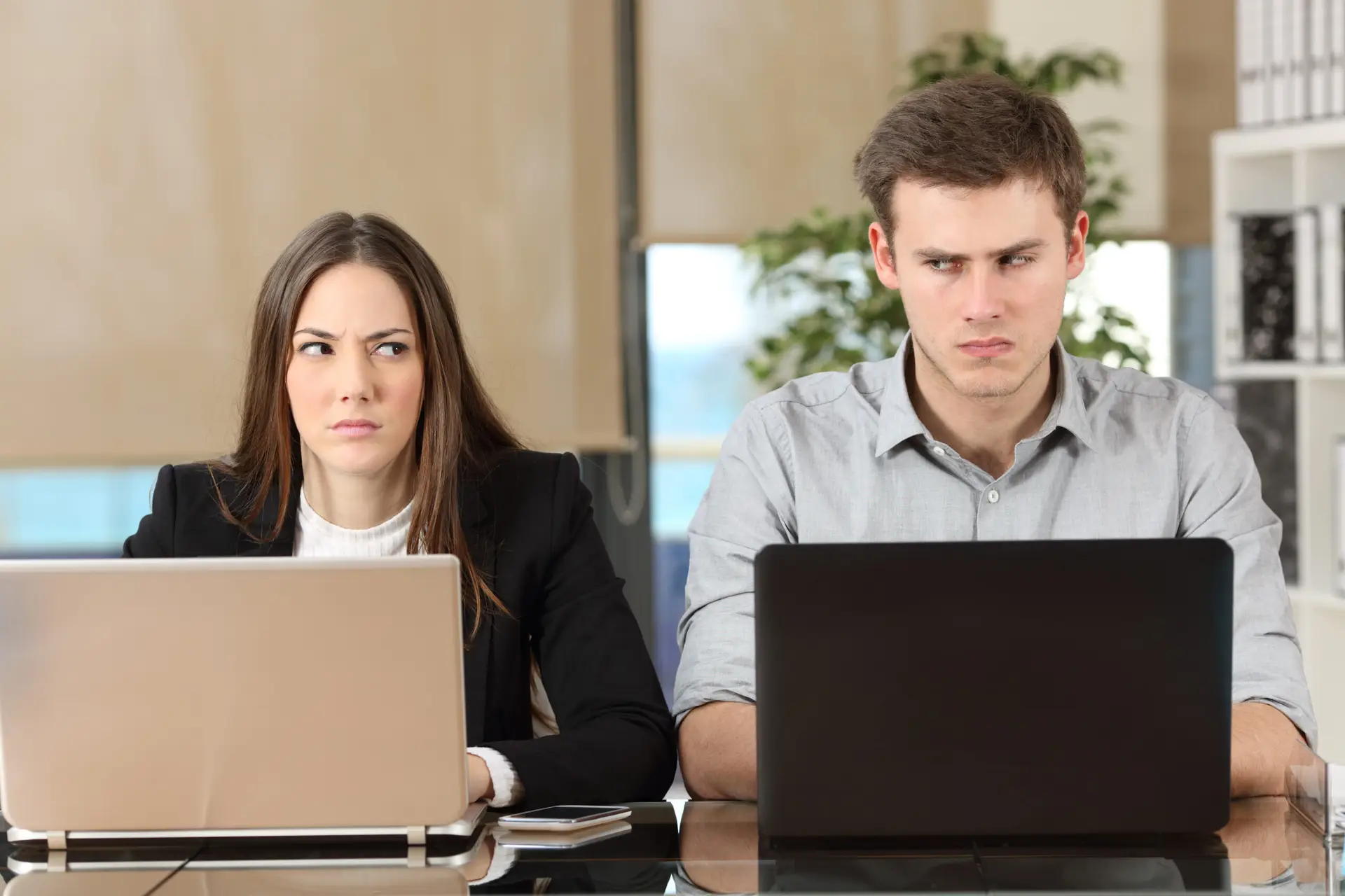Two coworkers appear angry